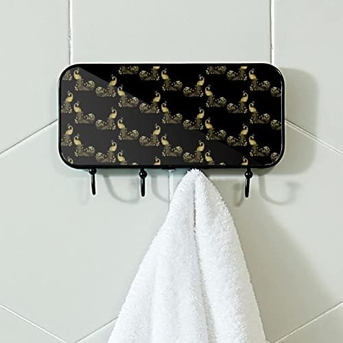 Zidne kuke s ljepljivim kukicama od nehrđajućeg čelika zaglavljene u kupaonici ili kuhinjskoj zlatnoj foliji i crnom paunu